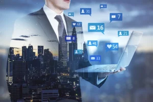 businessman holding laptop with social media icons 2026 01 11 08 35 54 utc | Advertising Avenue | Digital Marketing Agency
